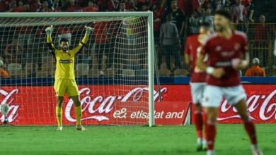 A Football Player In A Yellow Uniform Celebrating A Goal